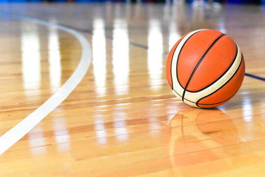 Basketball ball on Court Floor close up with blurred background