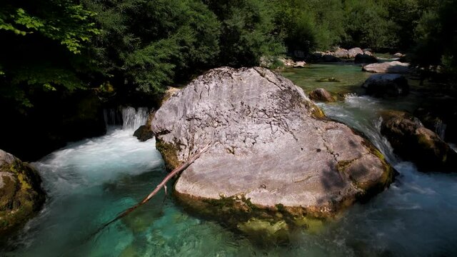 Cliffs splashed by clean fresh water of mountain river on beautiful valley of Valbone in Albania