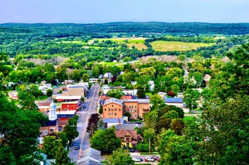 Aerial view of Montour Falls, a small historic village - Main Street, and surrounding hill forest...