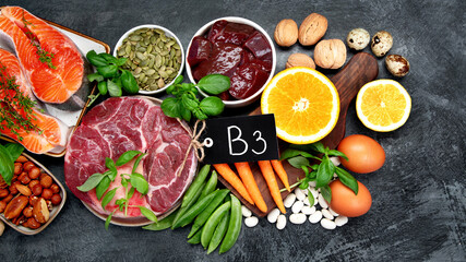 Food high in vitamin B3 on dark background.