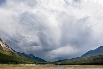 storm clouds over the valley. views of Canadian Rockies when you are driving along the Icefield Parkway in Jasper and Banff National Park, Alberta, Canada