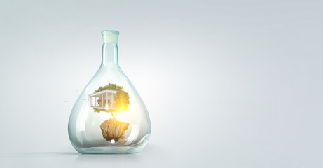 House inside a floating glass bottle . Mixed media