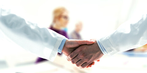 Partnership concept. Image of handshake . Mixed media