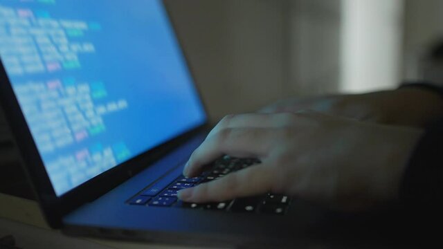 slow motion specialist programmer hand typing on keyboard on laptop check or command on software for run system at operation data center office for network engineering technology concept