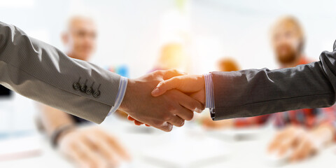 Partnership concept. Image of handshake . Mixed media