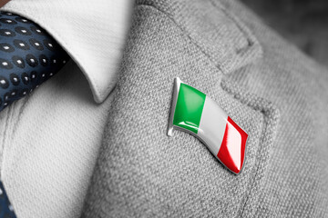 Metal badge with the flag of Italy on a suit lapel