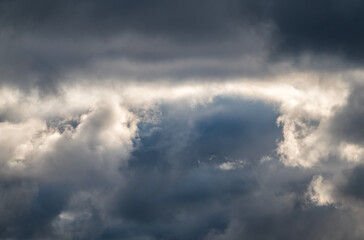 Naklejka na ściany i meble Dramatic cloudy sky background. Dark blue stormy cloudy sky. Natural photo background