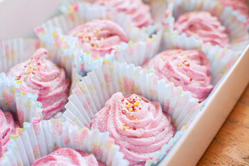 Delicious homemade sweet pink cherry or strawberry marshmallow in a gift box.