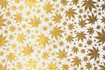 Golden leaves on white washi paper background image