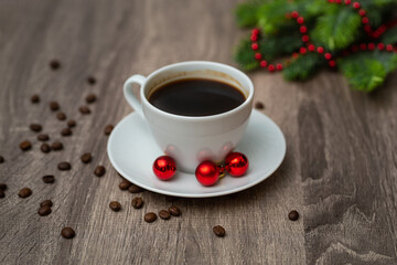 Coffee Cup with Christmas decorations on wooden table