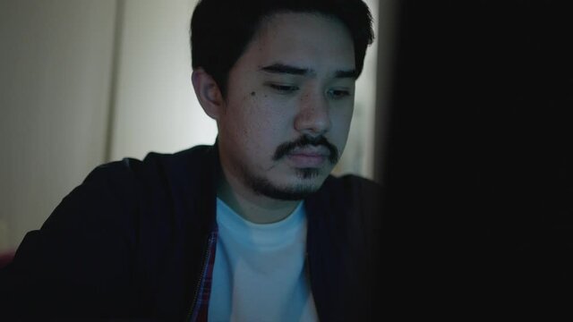 close up programmer man working at server room for input coding language to software for fix bug and defect of system in operation room , development of technology concept	