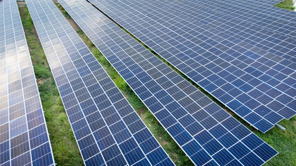 Aerial view over a modern solar farm. Solar panels station for collect green energy on concept of global ecosystem.