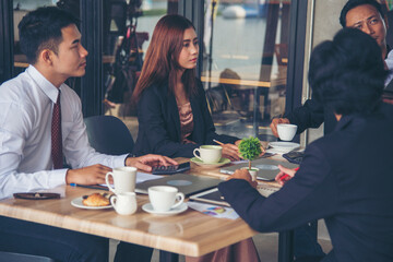 Group of business people meeting in conference room brainstorming consult business document graph chart office desk. Diversity multiethnic group of business people brainstorming and working together.