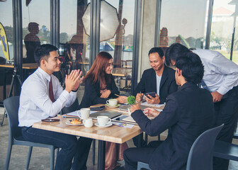 Group of business people meeting in conference room brainstorming consult business document graph chart office desk. Diversity multiethnic group of business people brainstorming and working together.