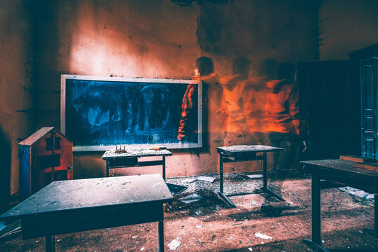Ghostly figure standing in an old abandoned school