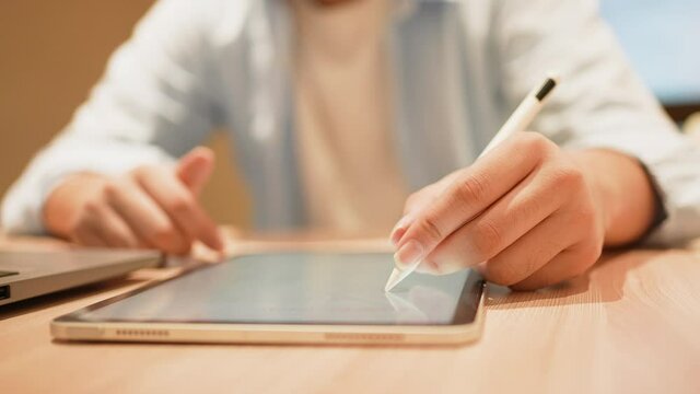 slow motion scene illustrator man hand use stylus pencil to create or draw about artwork on digital tablet in office for creative occupation concept