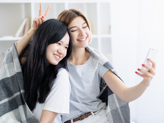 happy female friends home party ethnic diversity