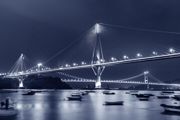 Idyllic landscape of bridge and bay in Hong Kong city at night