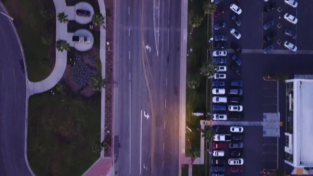 drone shot looking straight down at the street with cars on the road
