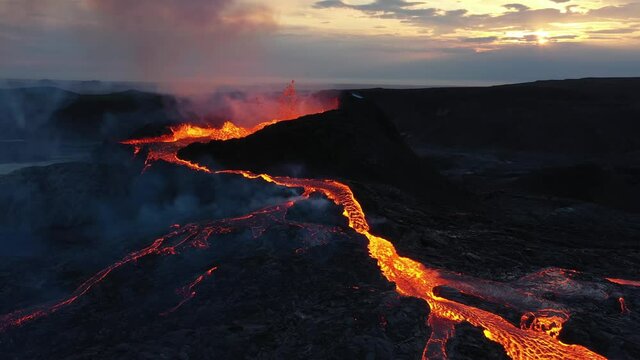 Aerial view over lava eruption, Mount Fagradalsfjall active, iceland
4K drone shot of lava spill out of the crater  Mount Fagradalsfjall, September 2021, Iceland 
