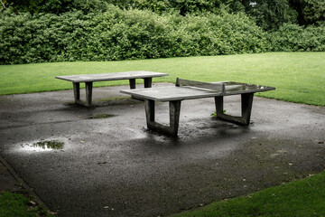 two table tennis table in the park