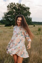Swirling woman with long hair outdoors at nature  - 455219435
