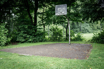 basket ball court outside, small and destroyed by vandalism