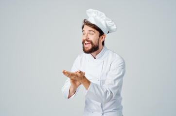 bearded man chef kitchen Job hand gestures light background