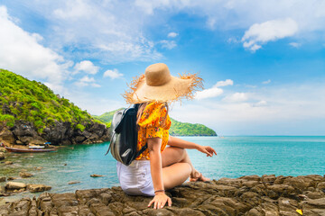 Summer lifestyle traveler woman relaxing on cliff joy nature outdoor scenic landscape, Adventure...