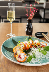 sushi and  white wine in restaurant