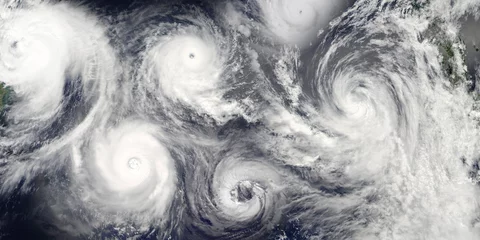 Selbstklebende Fototapeten Hurricanes season. Collage of a riot of hurricanes due to catastrophic climate change. Satellite view. Elements of this image furnished by NASA. © elen31