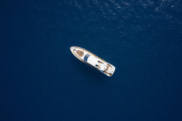 Super yacht on blue water top view. Huge white super Mega yacht on blue water in Italy. White sport...