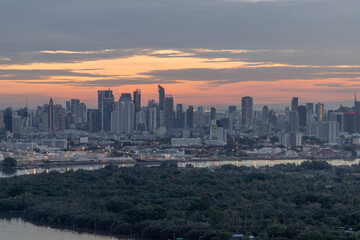 Fototapeta premium Bangkok, thailand - May 28, 2020 : Sky view of Bangkok with skyscrapers in the business district in Bangkok in the evening beautiful twilight give the city a modern style. Selective focus.
