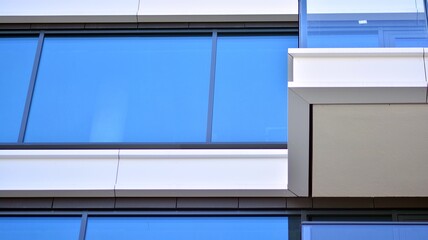 Condominium and apartment building with  symmetrical modern architecture in the city downtown.