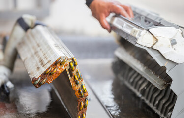 Close up of Rust and dirty inside compartments air conditioner, repairman clean mold in system air...