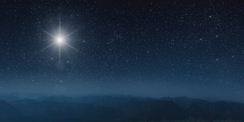 Fototapeta na wymiar The star shines over the manger of christmas of Jesus Christ.