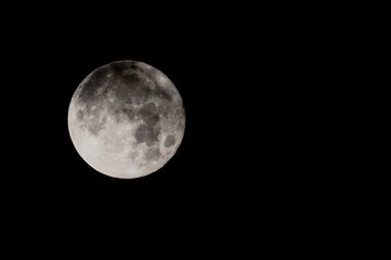 Full Blue Moon in a Black Night Sky