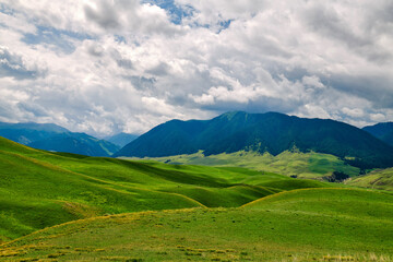 Fototapeta premium Mountains and clouds landscape in summer
