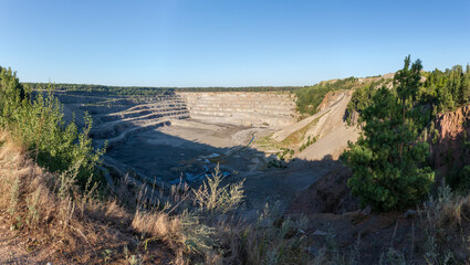 General view of operating granite quarry in summer morning