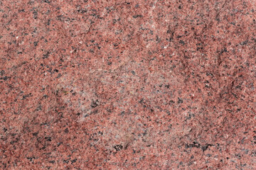 Torn edge of the red granite block, texture, background