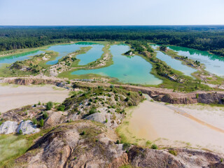 Colored lakes, rock dumps in abandoned ilmenite quarry, aerial view