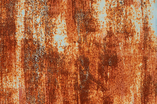 Old metal surface covered with paint through which rust appears. Smudges texture with elements of corrosion © yanik88