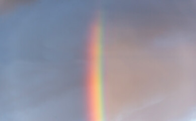 Bright Rainbow on a Sunny and Cloudy Morning