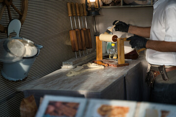 Trdelnik traditional Czech hot sweet pastry sold in the streets of Prague and another cities of Czech Republic. Czech cuisine and street food.