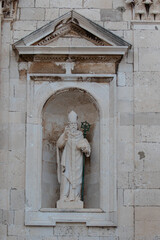 Sculpture of Saint Vlaho (Blaise), patron saint of the city of Dubrovnik, on the facade of the Cathedral of the Assumption of the Virgin Mary in Croatia