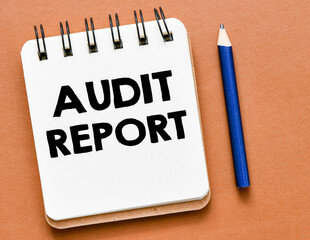 Text audit report written in a notebook