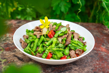 A dish of fried pork with concanavali beans in Hunan, China