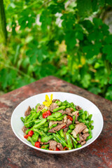 A dish of fried pork with concanavali beans in Hunan, China