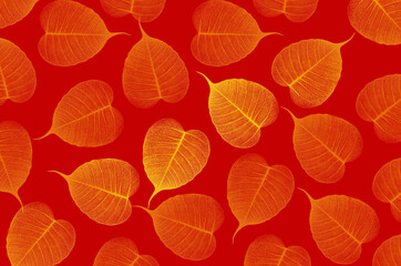 Yellow Bodhi vein leaf pattern on red background