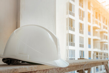 white helmet in the construction site of high-rise buildings